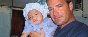 Dr. Rose Holds a Patient Being Prepared for Cleft Lip Surgery