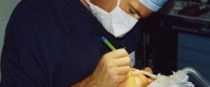 Dr. Rose Performing Surgery with Tool