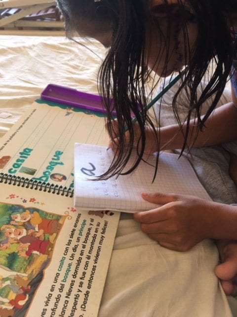Child practicing letter writing
