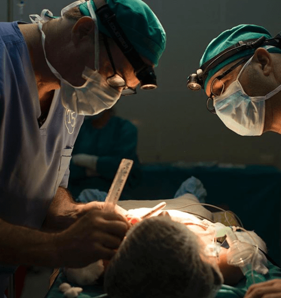 Dr Beck performing surgery on patient